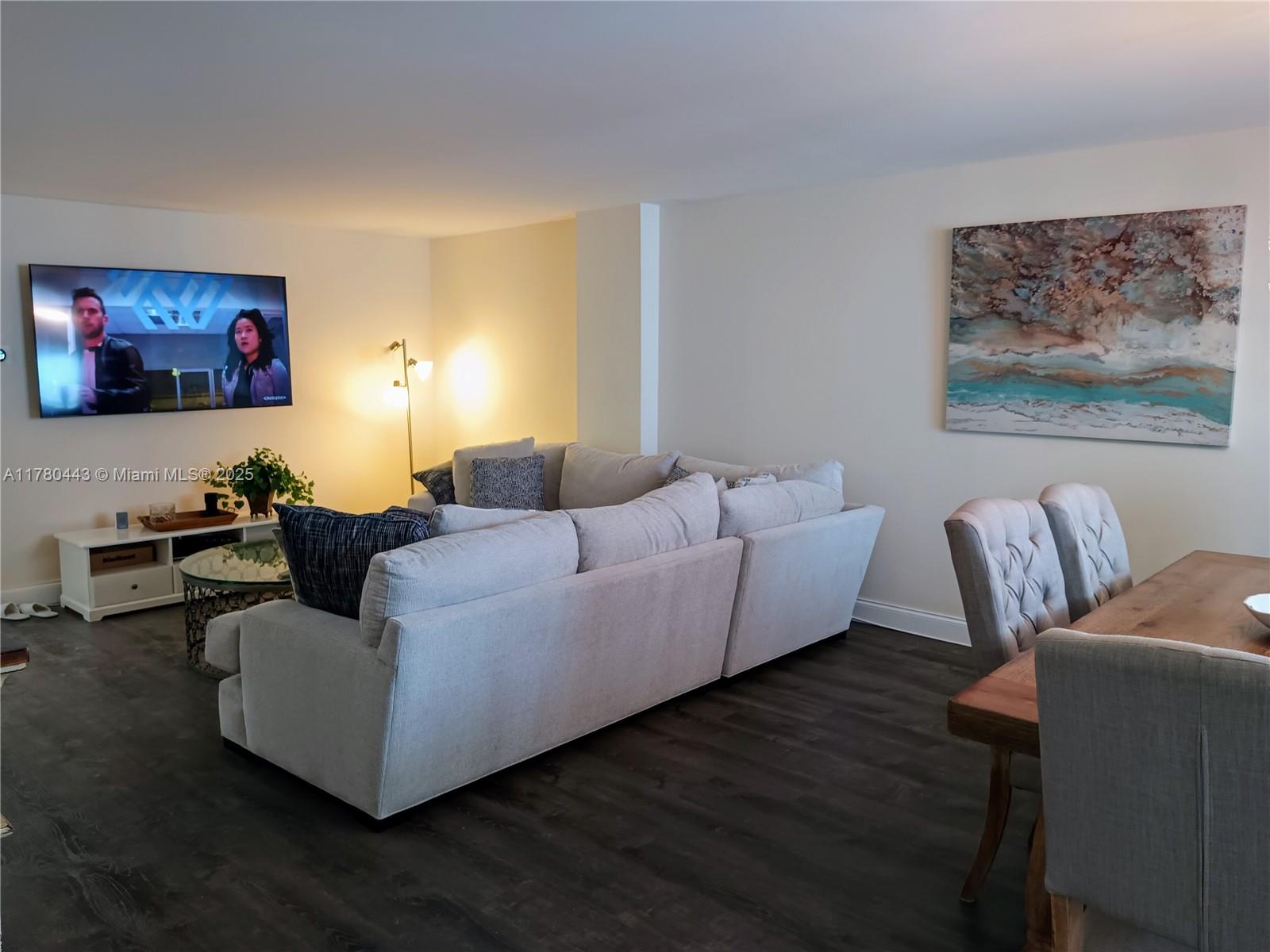 1000 South Ocean Boulevard, Unit 10E Pompano Beach, FL 33062 - Photo 23 of 64 a living room with furniture and a flat screen tv