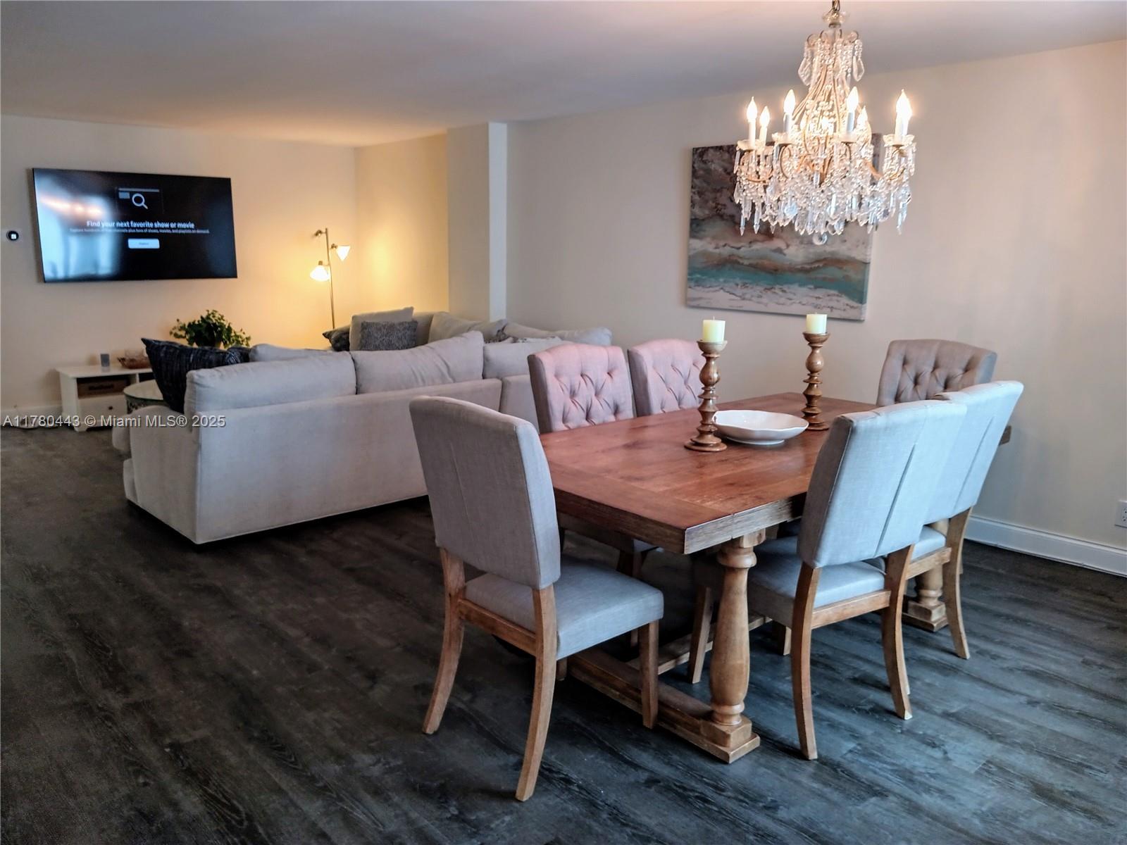 1000 South Ocean Boulevard, Unit 10E Pompano Beach, FL 33062 - Photo 24 of 64 a view of a dining room with furniture wooden floor and chandelier