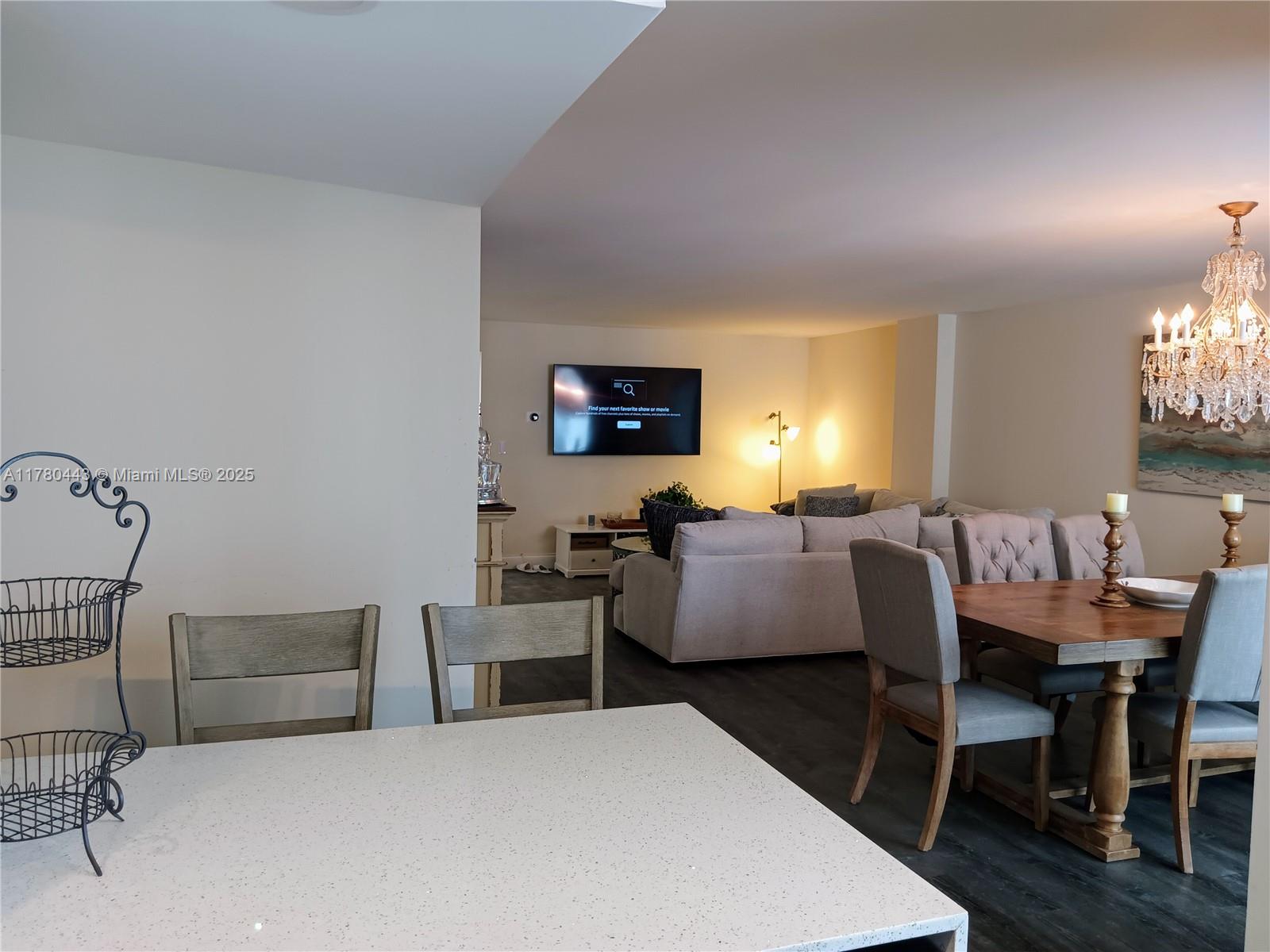 1000 South Ocean Boulevard, Unit 10E Pompano Beach, FL 33062 - Photo 28 of 64 a room with a bed and a table in it