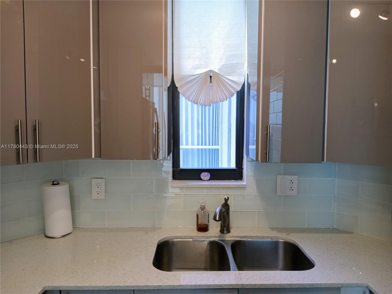 1000 South Ocean Boulevard, Unit 10E Pompano Beach, FL 33062 - Photo 31 of 64 a bathroom with a sink and a mirror