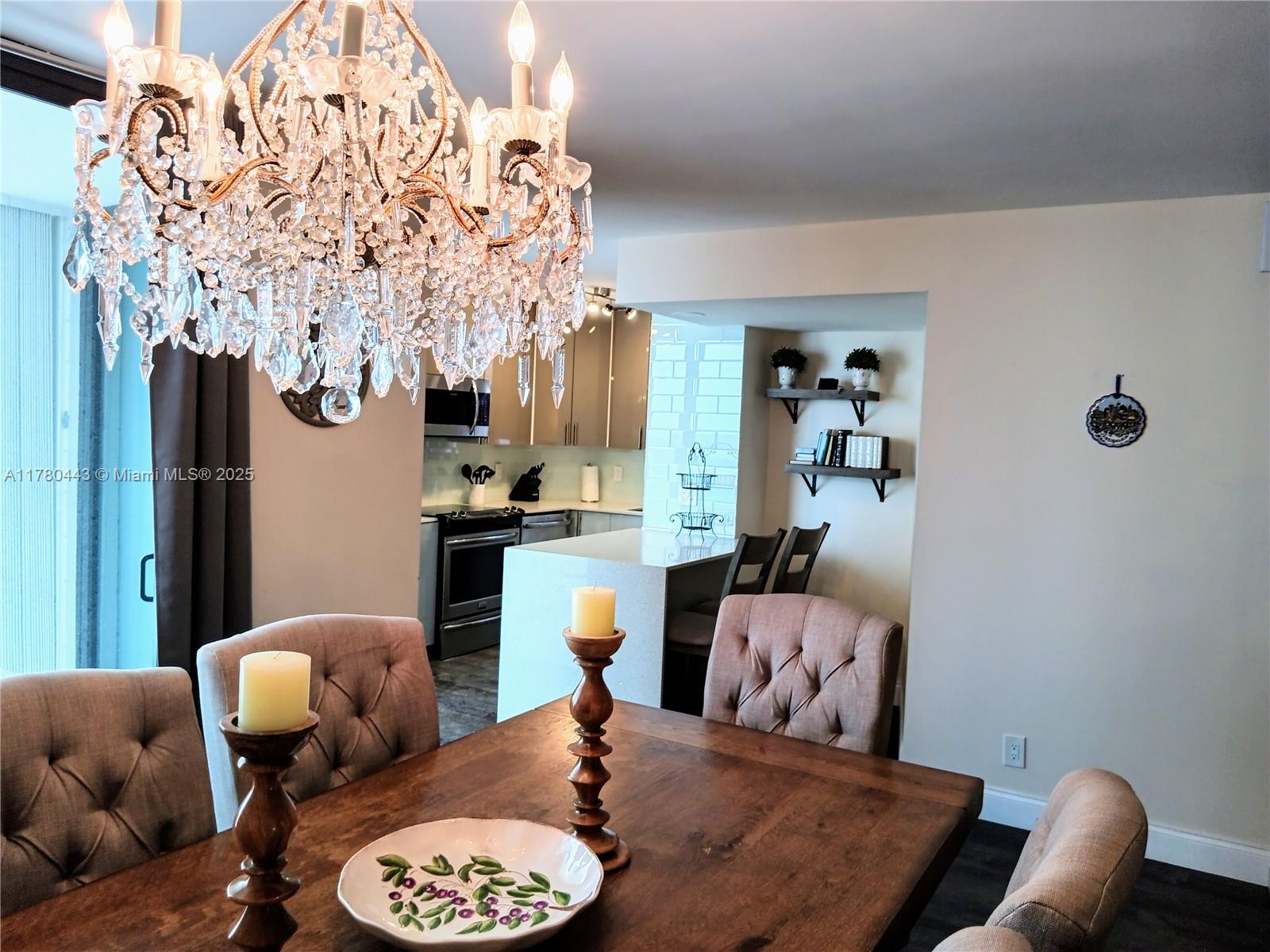 1000 South Ocean Boulevard, Unit 10E Pompano Beach, FL 33062 - Photo 36 of 64 a living room with furniture and a chandelier