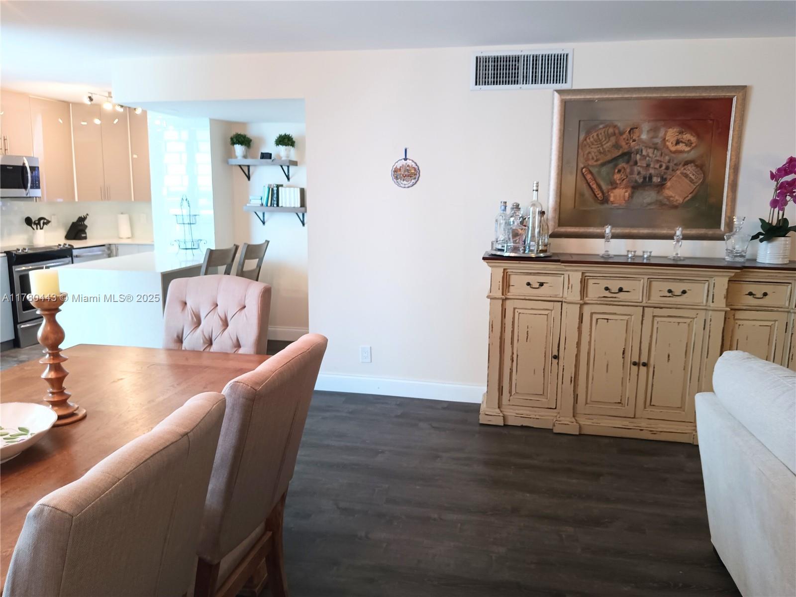 1000 South Ocean Boulevard, Unit 10E Pompano Beach, FL 33062 - Photo 45 of 64 a view of a dining room with furniture window and wooden floor