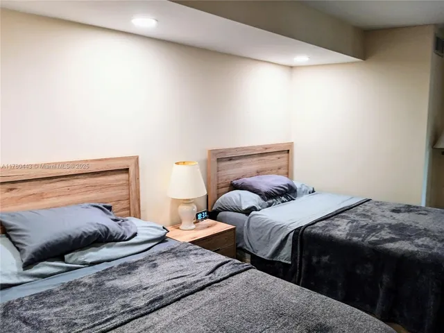 a bathroom with a sink a mirror and shower