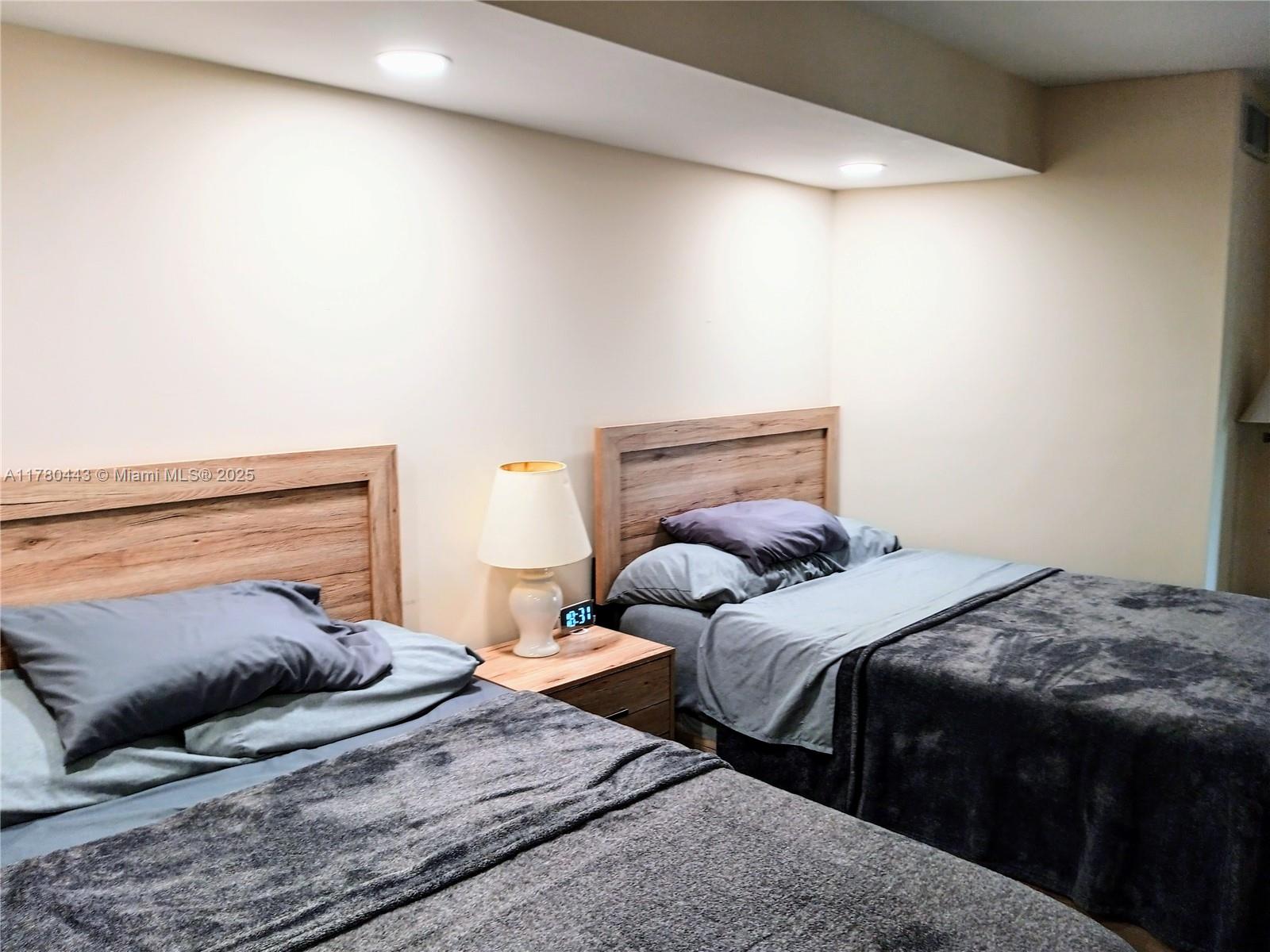 1000 South Ocean Boulevard, Unit 10E Pompano Beach, FL 33062 - Photo 47 of 64 a bedroom with a bed and a couch