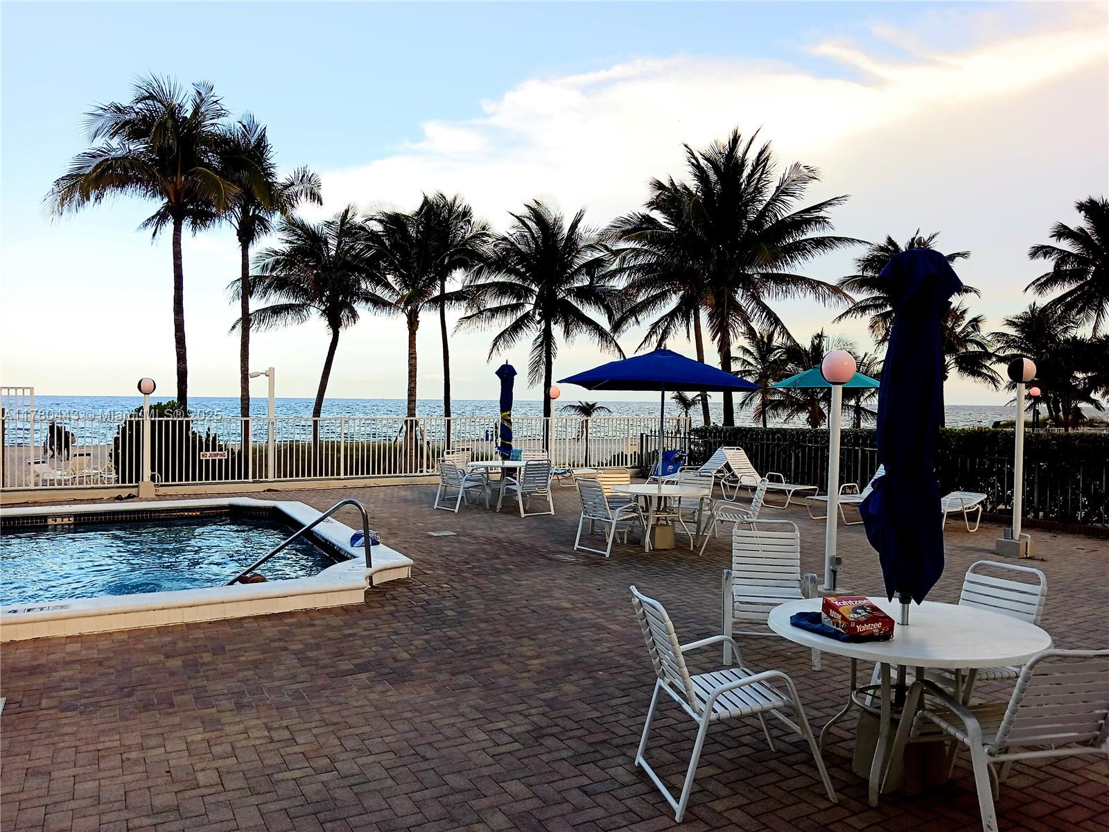 1000 South Ocean Boulevard, Unit 10E Pompano Beach, FL 33062 - Photo 6 of 64 a view of a backyard with swimming pool and sitting area