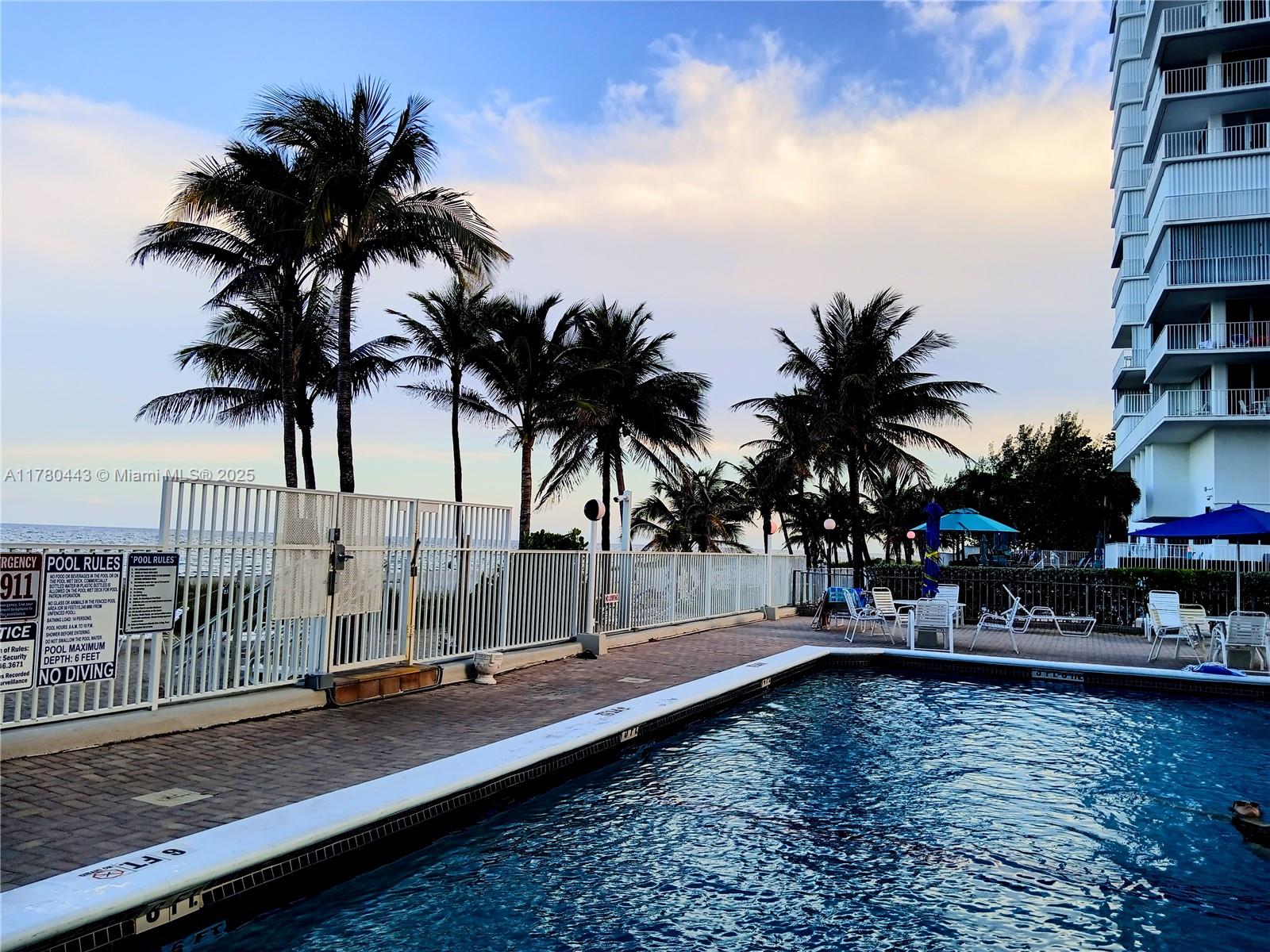 1000 South Ocean Boulevard, Unit 10E Pompano Beach, FL 33062 - Photo 10 of 64 a view of swimming pool with a table and chairs