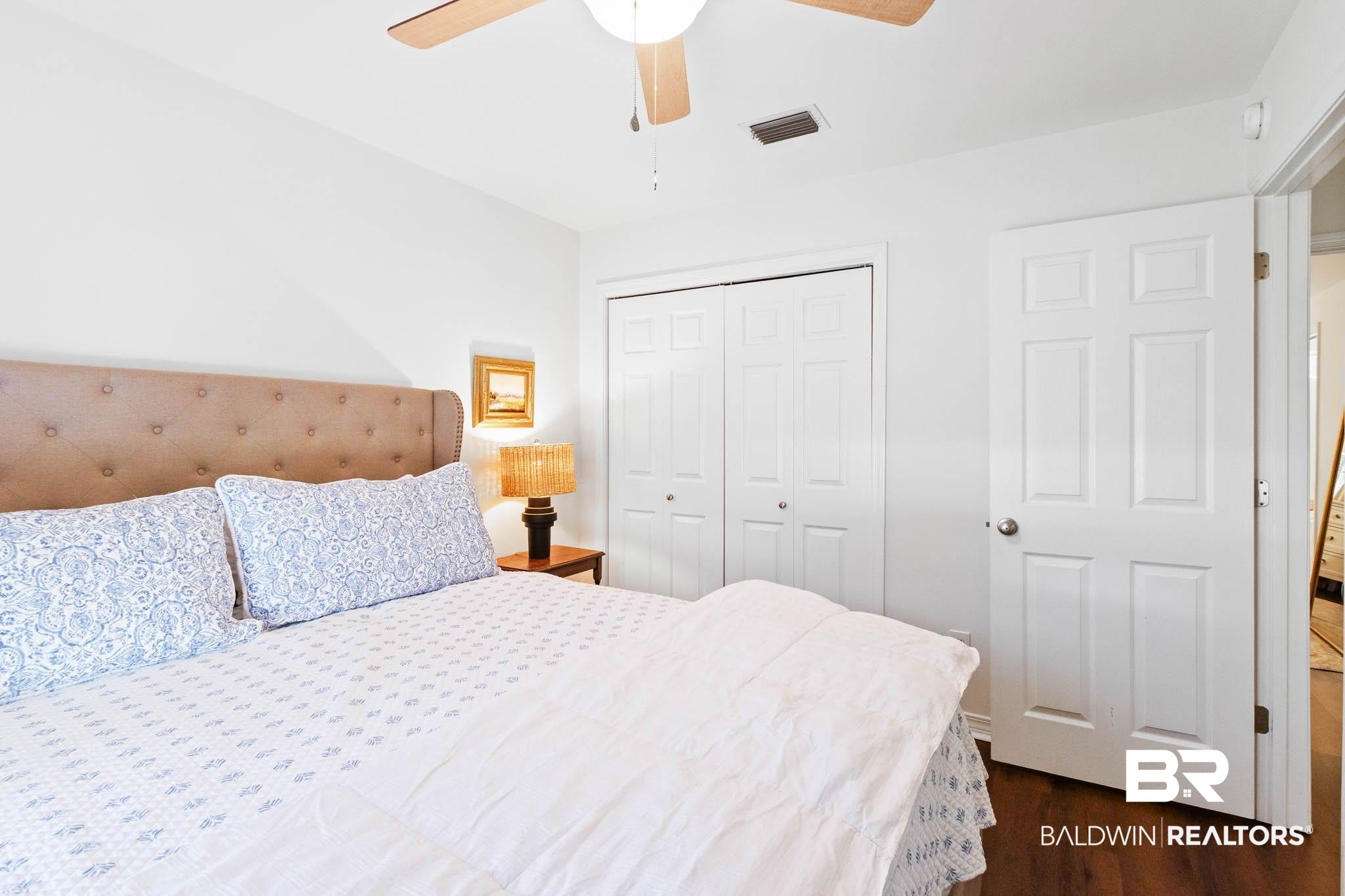 20685 Lowry Drive Fairhope, AL 36532 - Photo 40 of 48 Bedroom with dark wood-style flooring, a closet, and a ceiling fan