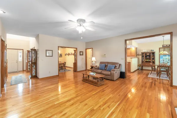 a view of a dining room with furniture and wooden floor