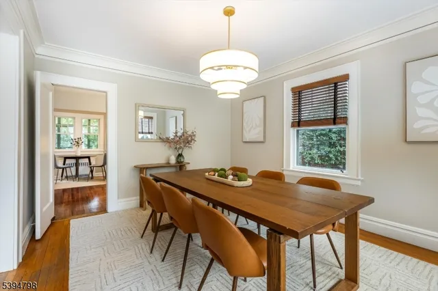 a view of a dining room with furniture and window