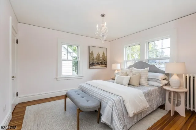 a bedroom with bed and a window