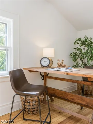 a view of a chairs and table in a room