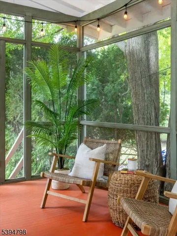 a view of a chairs and table in patio