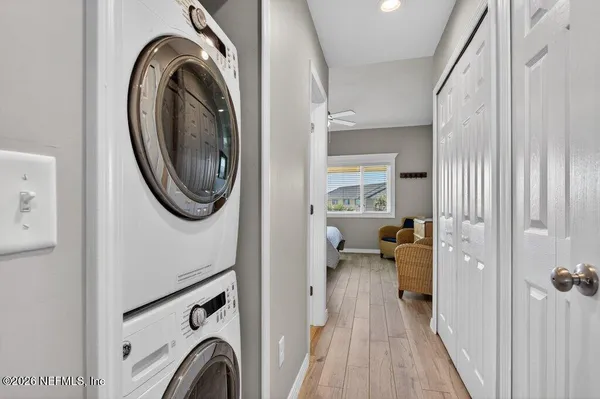 a view of a bedroom with washer and dryer