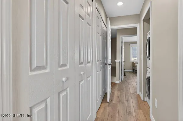 a view of a hallway with a wooden door