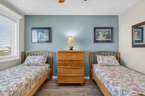 a bedroom with a bed and a view of bedroom