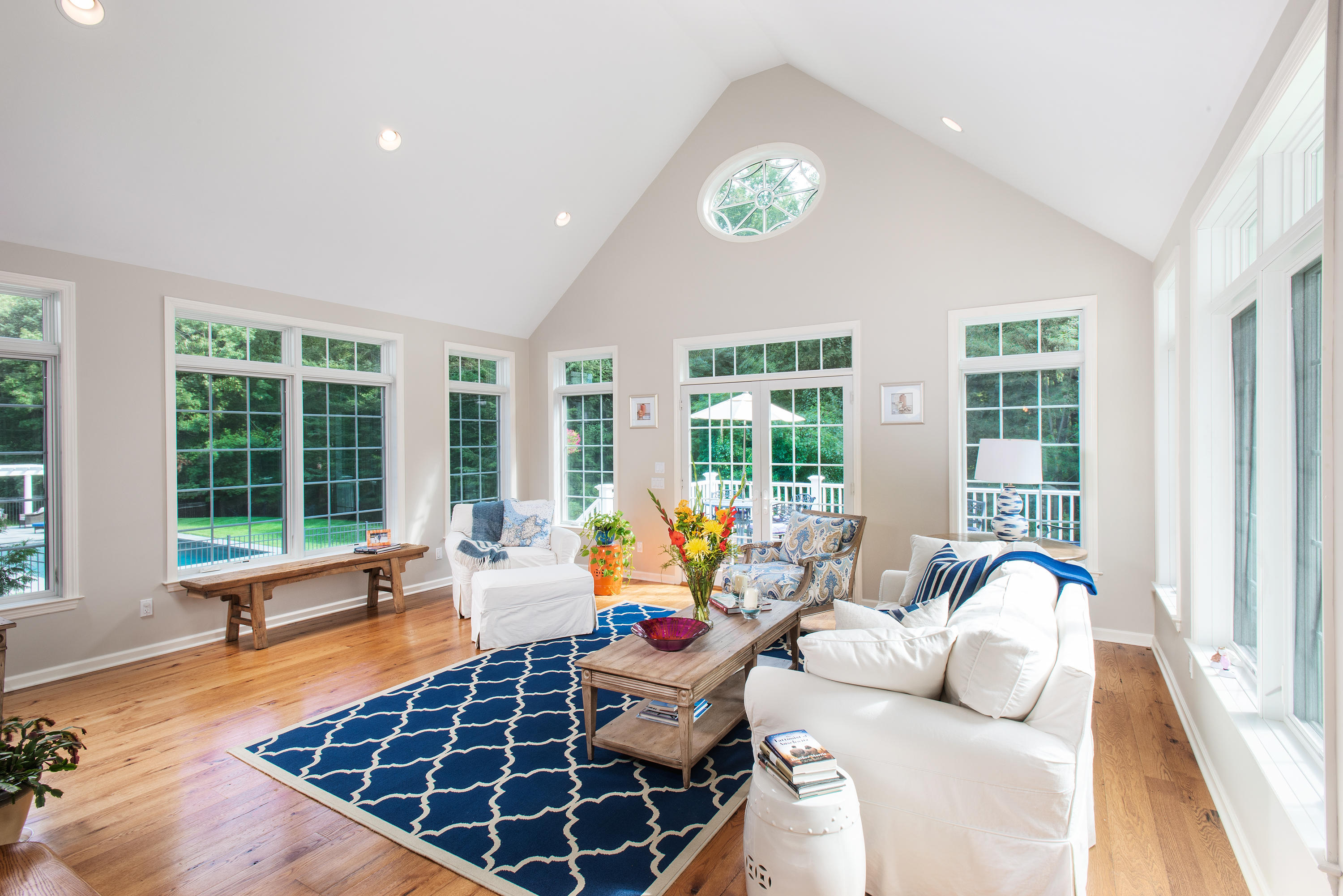 1381 Smith Ridge Road New Canaan, CT 06840 - Photo 14 of 35 a living room with furniture and floor to ceiling windows