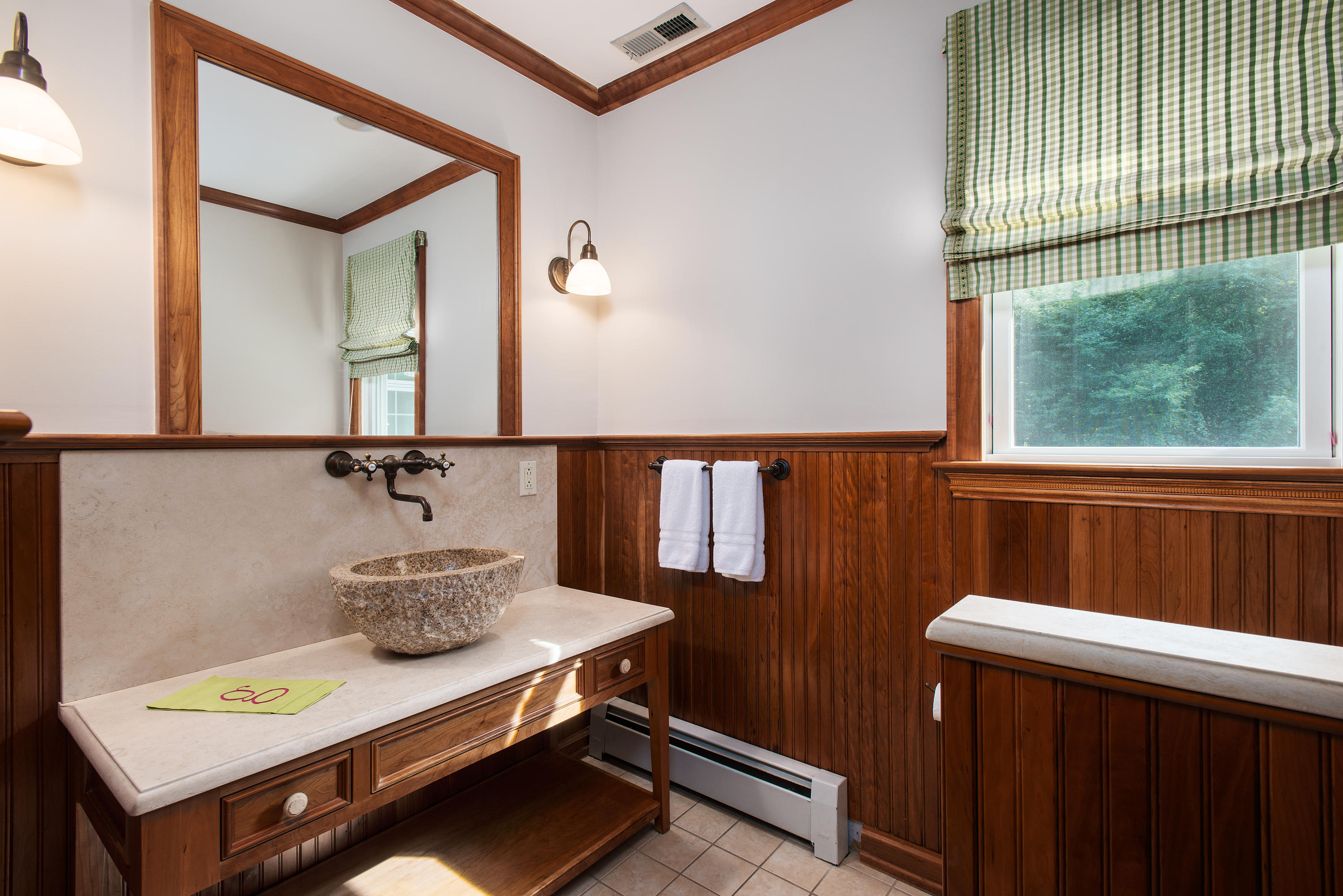 1381 Smith Ridge Road New Canaan, CT 06840 - Photo 18 of 35 a bathroom with a sink a mirror and a toilet