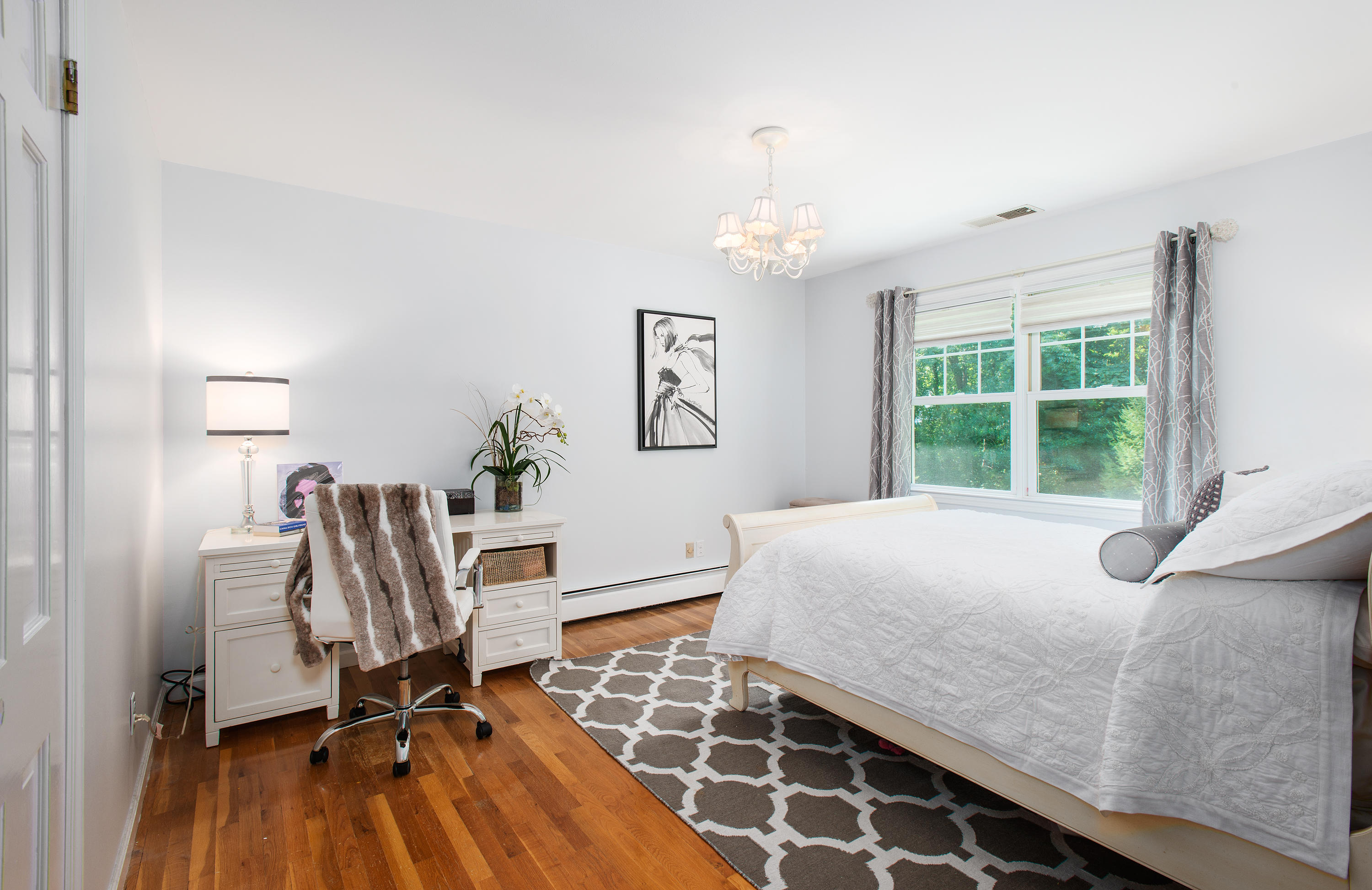 1381 Smith Ridge Road New Canaan, CT 06840 - Photo 20 of 35 a bedroom with a bed and a window