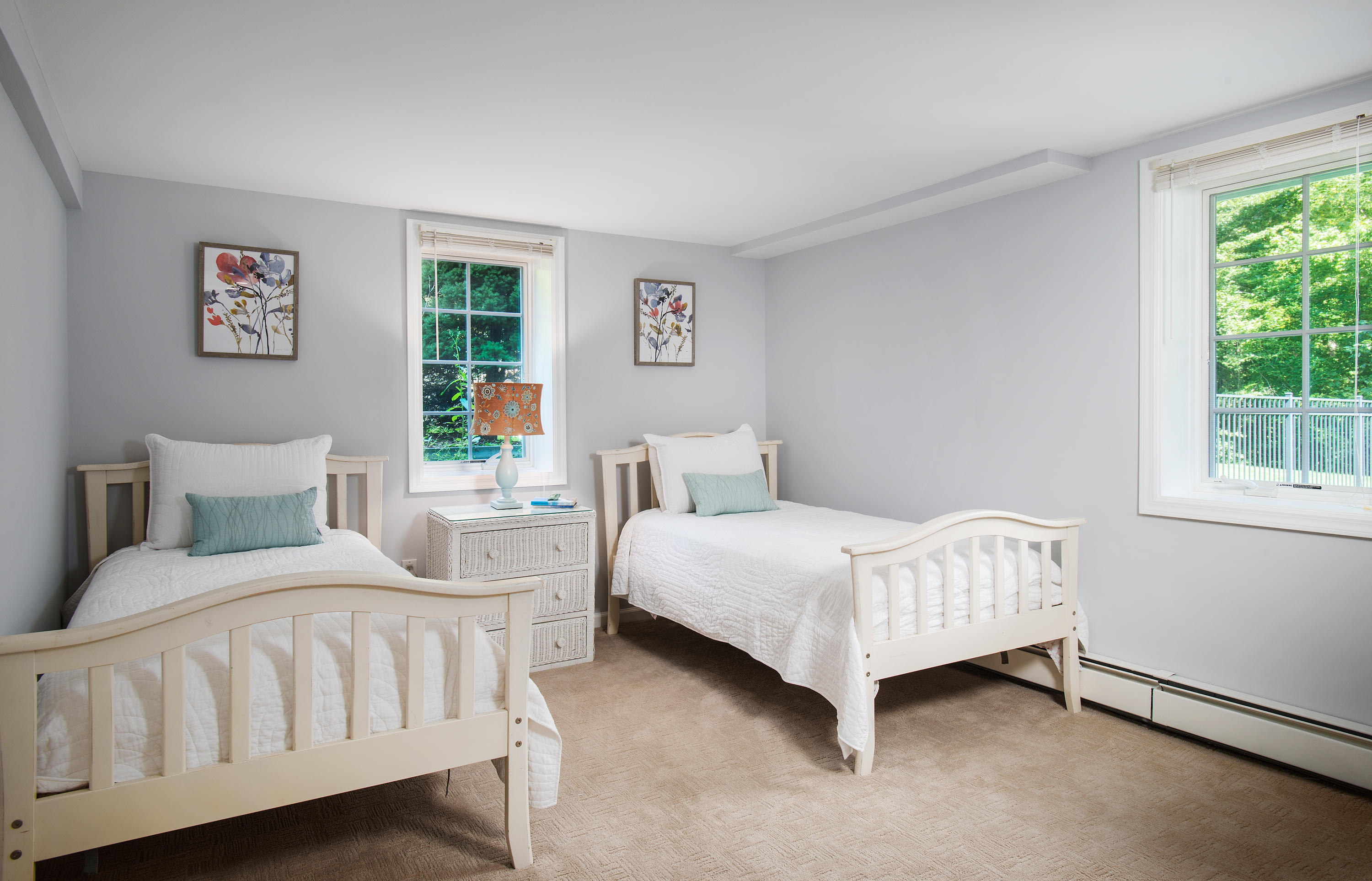 1381 Smith Ridge Road New Canaan, CT 06840 - Photo 24 of 35 a bedroom with a bed lamp and a window