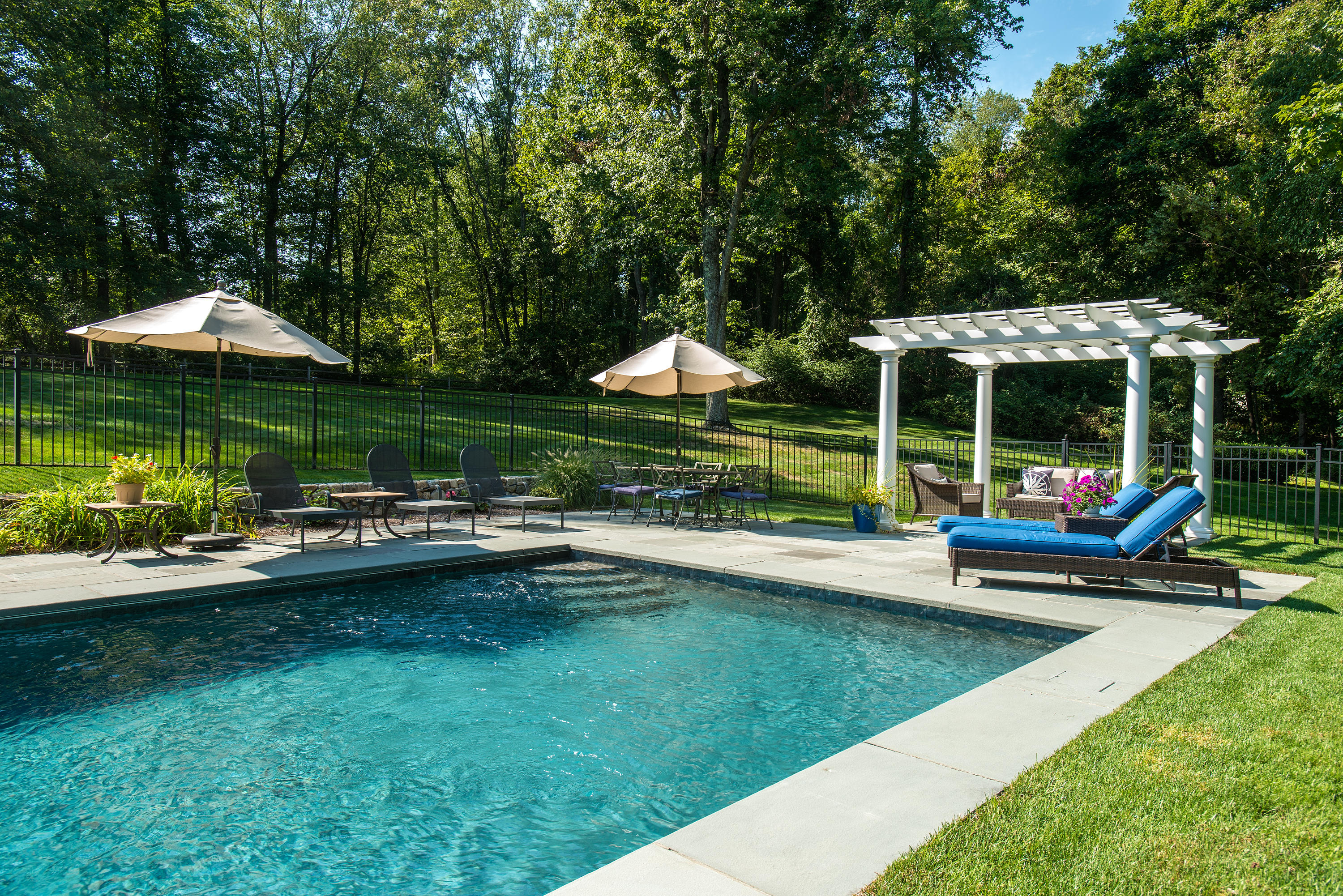 1381 Smith Ridge Road New Canaan, CT 06840 - Photo 5 of 35 a view of a house with a yard patio and swimming pool