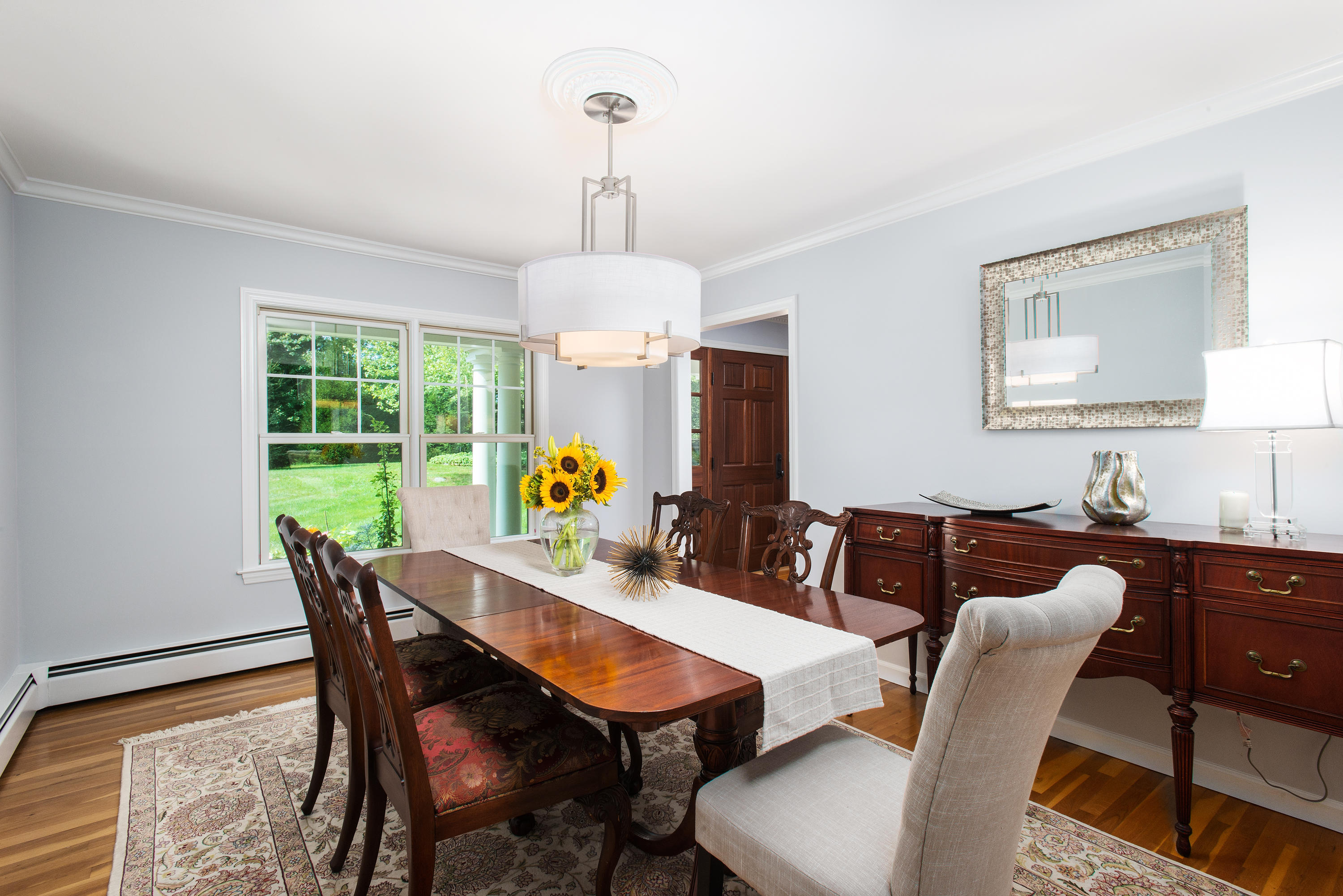 1381 Smith Ridge Road New Canaan, CT 06840 - Photo 10 of 35 a view of a dining room with furniture window and outside view