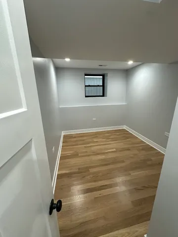 a view of a hallway with stairs