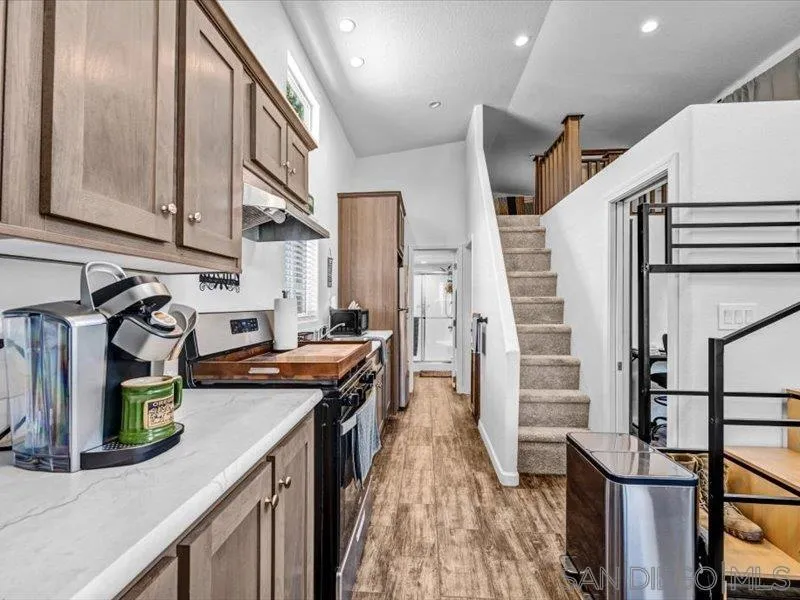 14291 Rios Canyon Road, Unit 3 El Cajon, CA 92021 - Photo 12 of 16 a kitchen that has a lot of cabinets in it