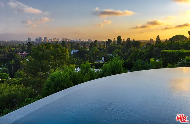 a view of a river and garden