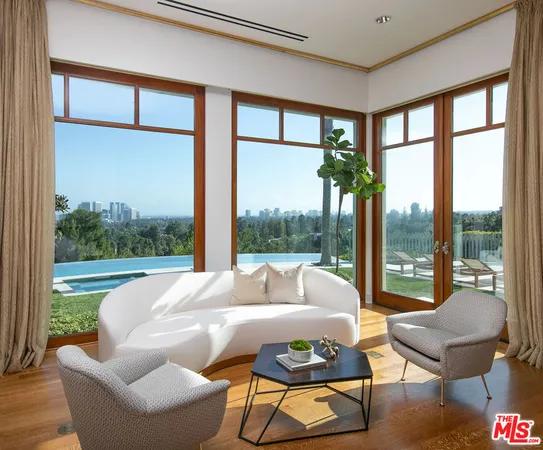 a living room with a couch and a large window