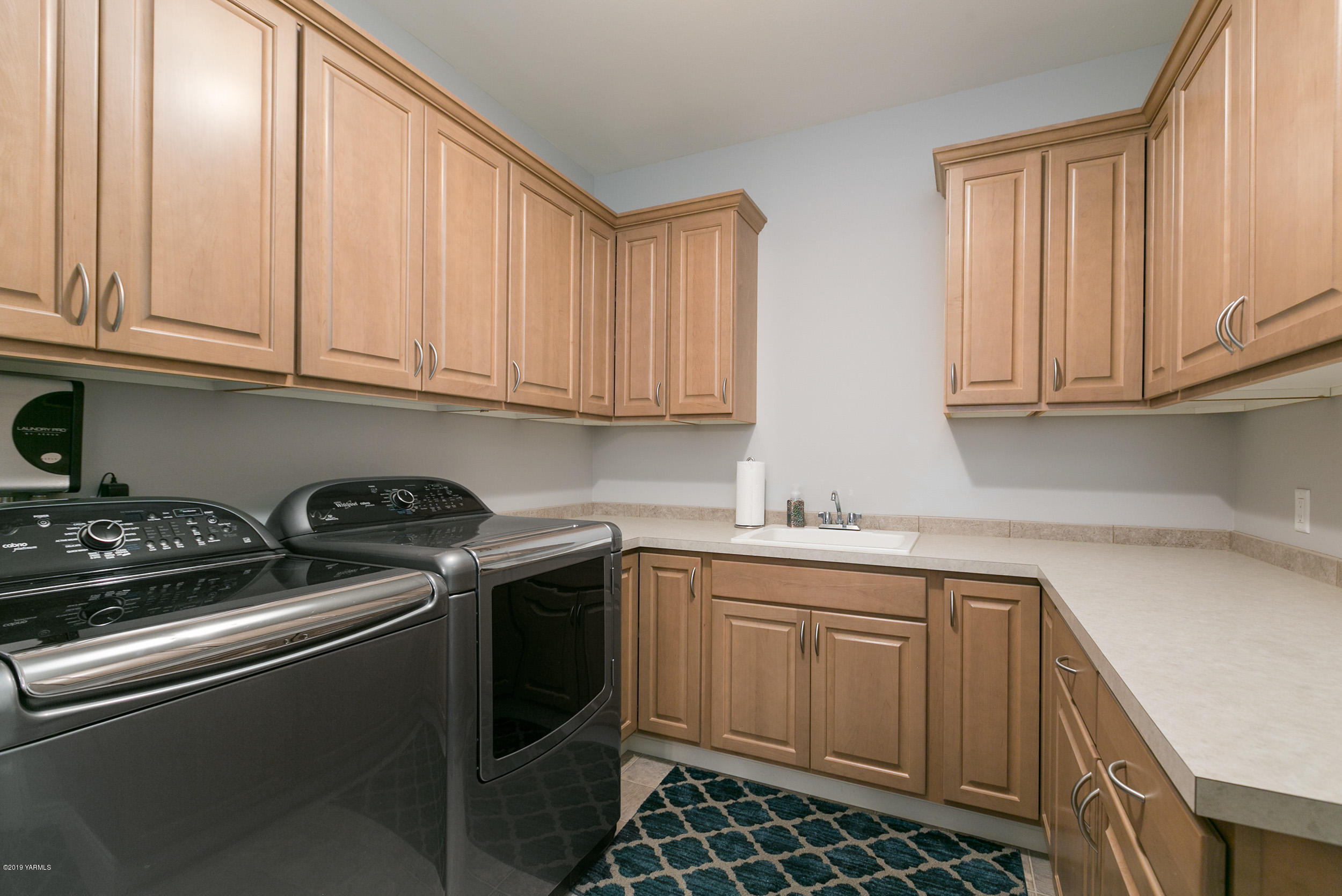 1002 Meadowbrook Road Union Gap, WA 98903 - Photo 22 of 27 a kitchen with stainless steel appliances granite countertop a sink stove and cabinets