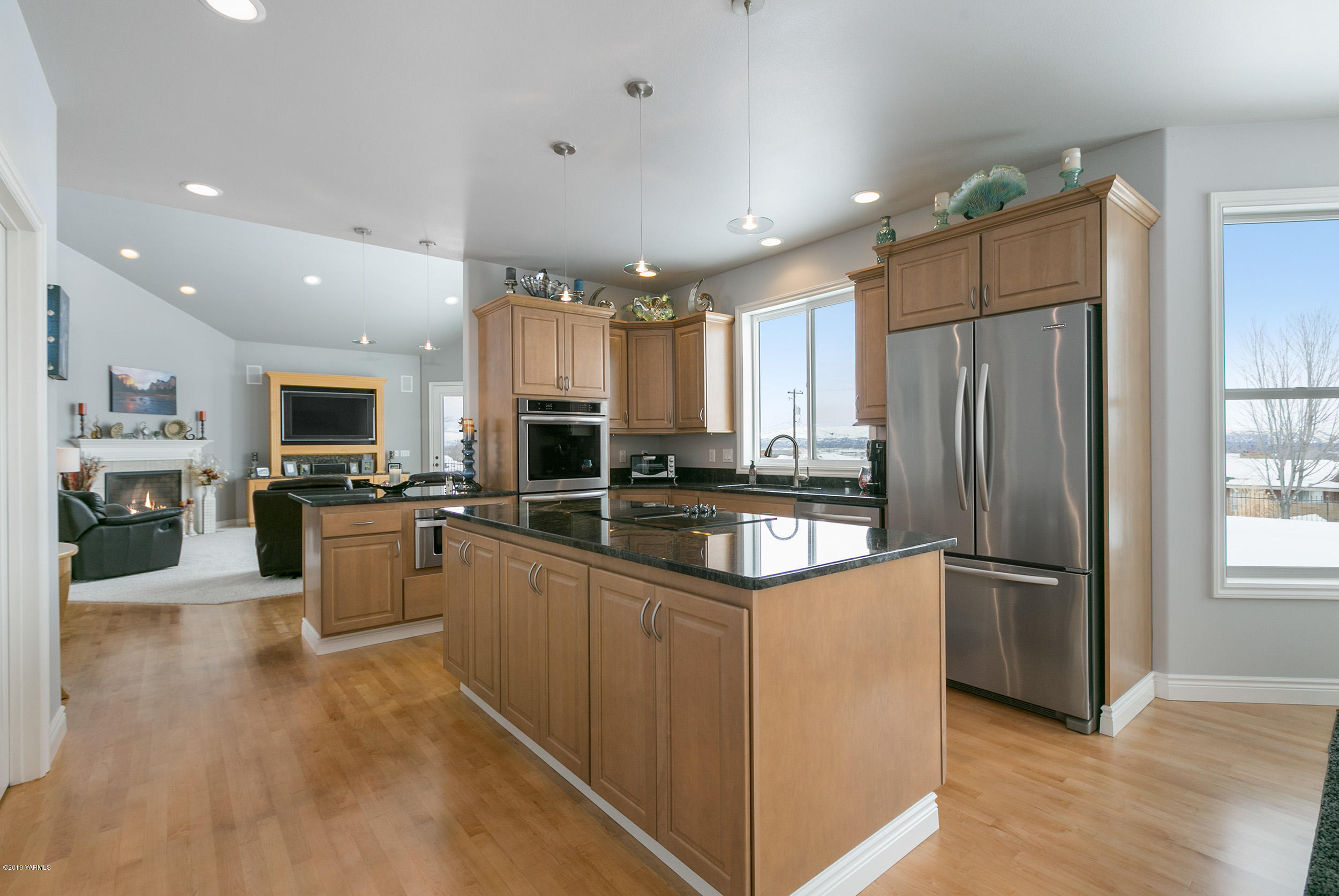 1002 Meadowbrook Road Union Gap, WA 98903 - Photo 8 of 27 a kitchen with stainless steel appliances granite countertop a refrigerator oven a sink dishwasher and a refrigerator with wooden floor
