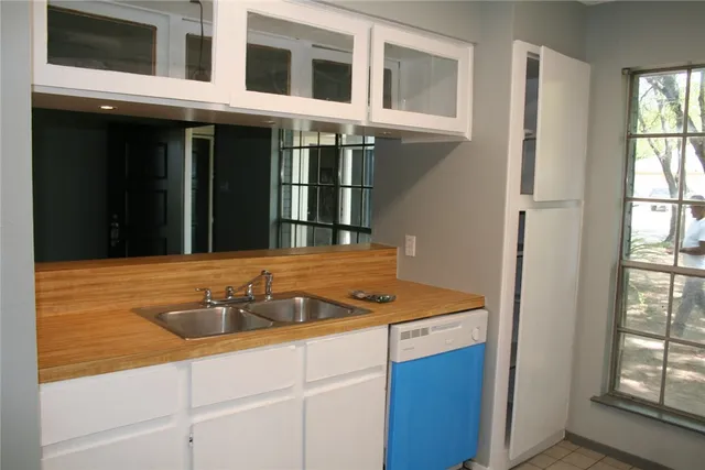 a bathroom with a sink and a window