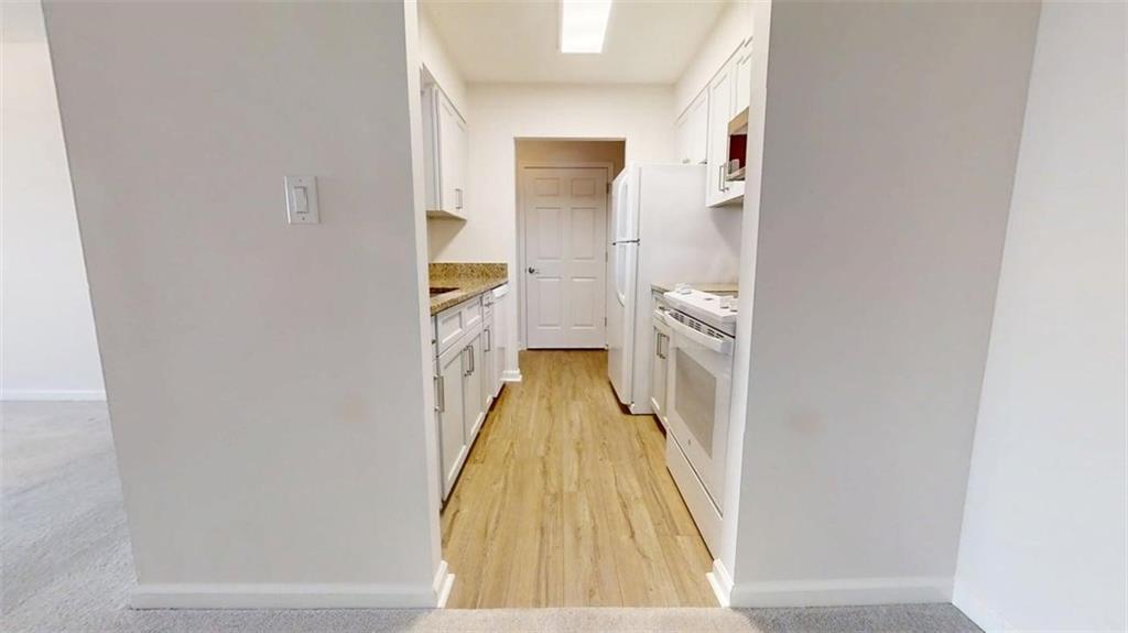 300 Johnson Ferry Road, Unit B805 Sandy Springs, GA 30328 - Photo 14 of 31 a view of a bathroom from a hallway