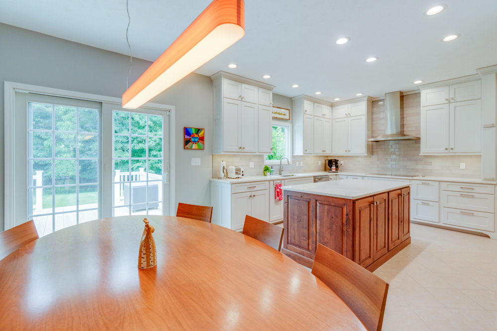 3550 East Bishop Road Mount Vernon, IL 62864 - Photo 17 of 61 a large white kitchen with wooden floor and stainless steel appliances