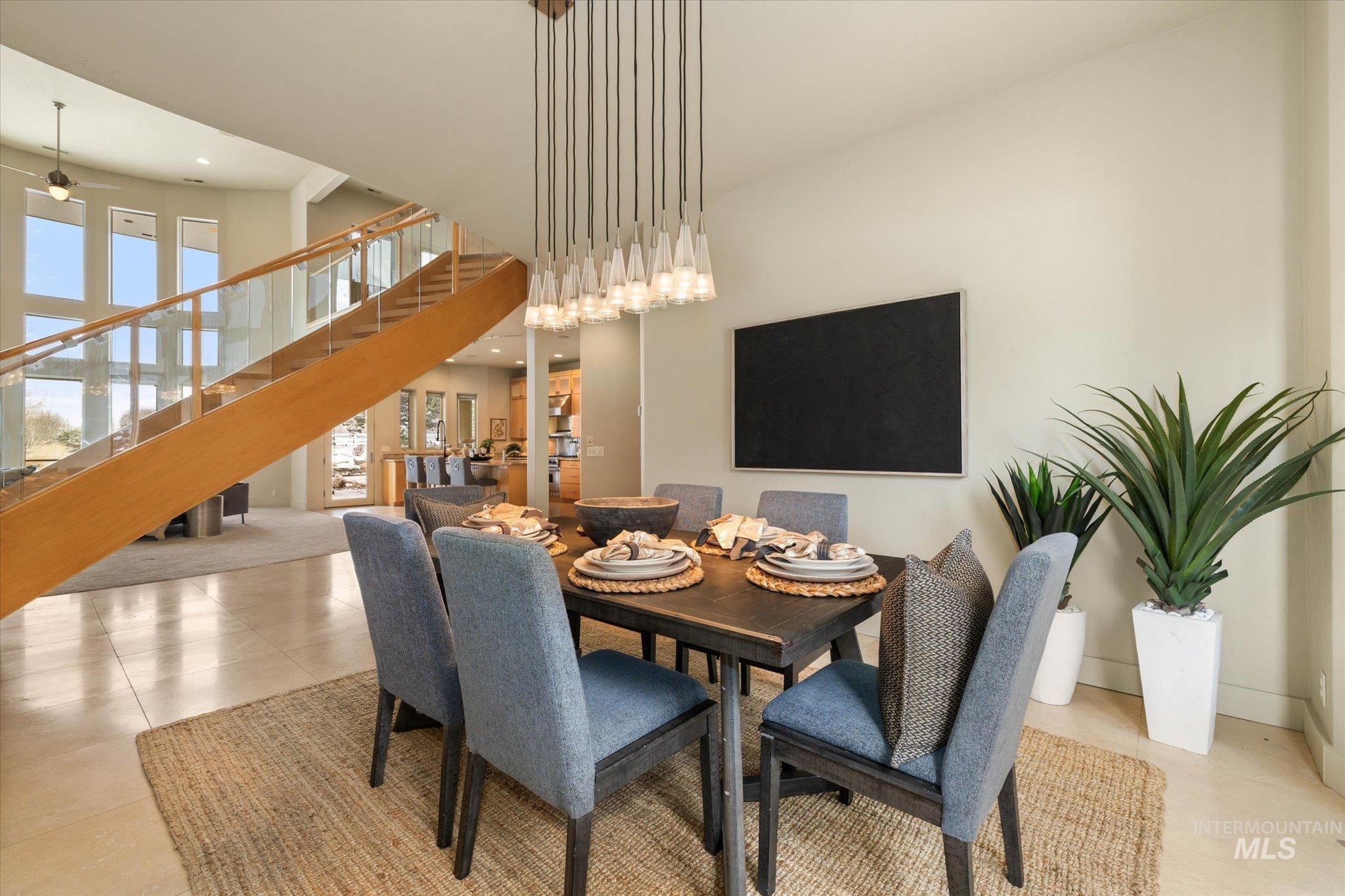1400 North Razza Way Eagle, ID 83616 - Photo 11 of 50 Dining space featuring recessed lighting, a high ceiling, and light tile patterned floors