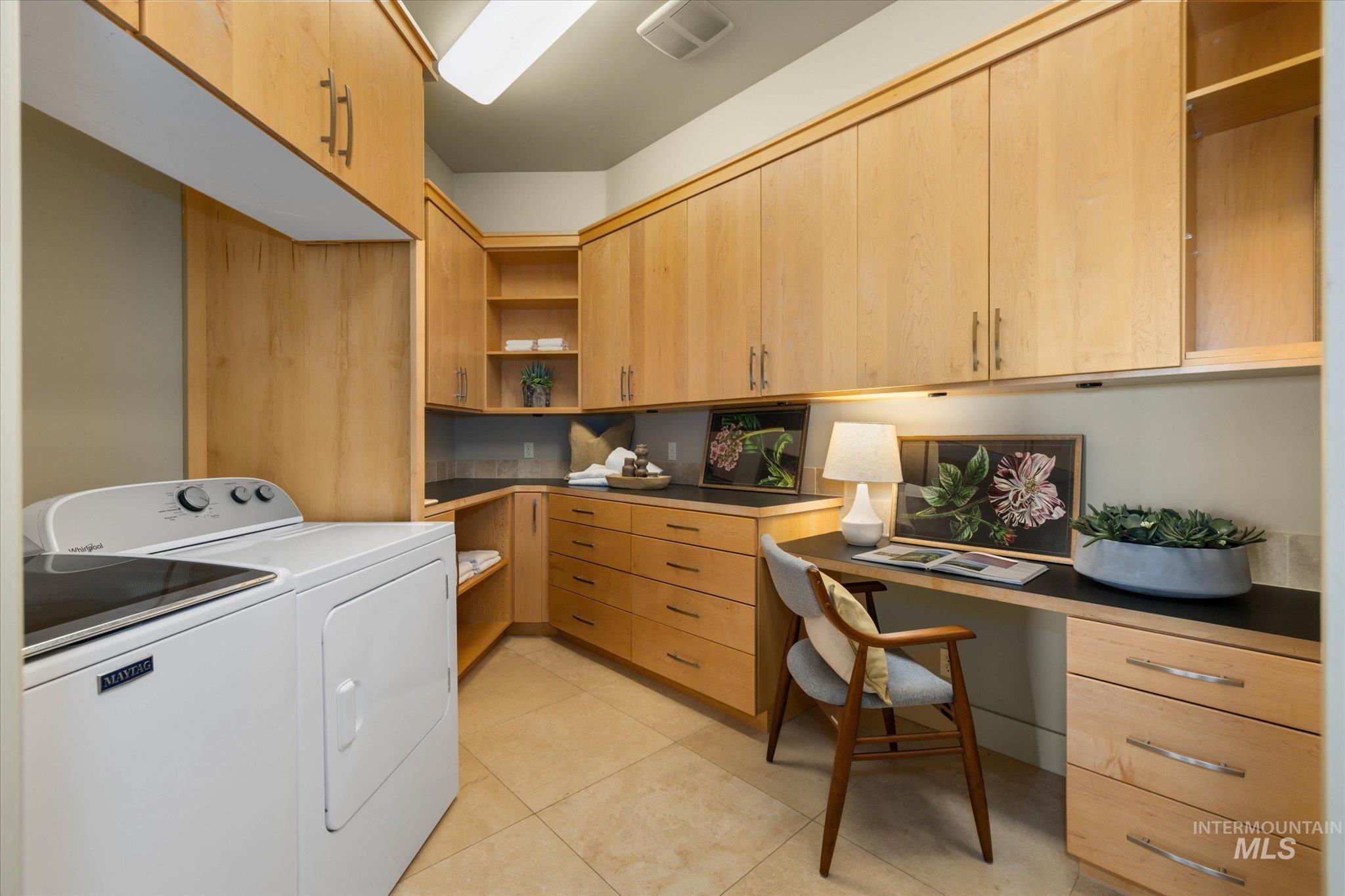 1400 North Razza Way Eagle, ID 83616 - Photo 19 of 50 Laundry area featuring cabinet space, washer and dryer, an office area, and light tile patterned floors
