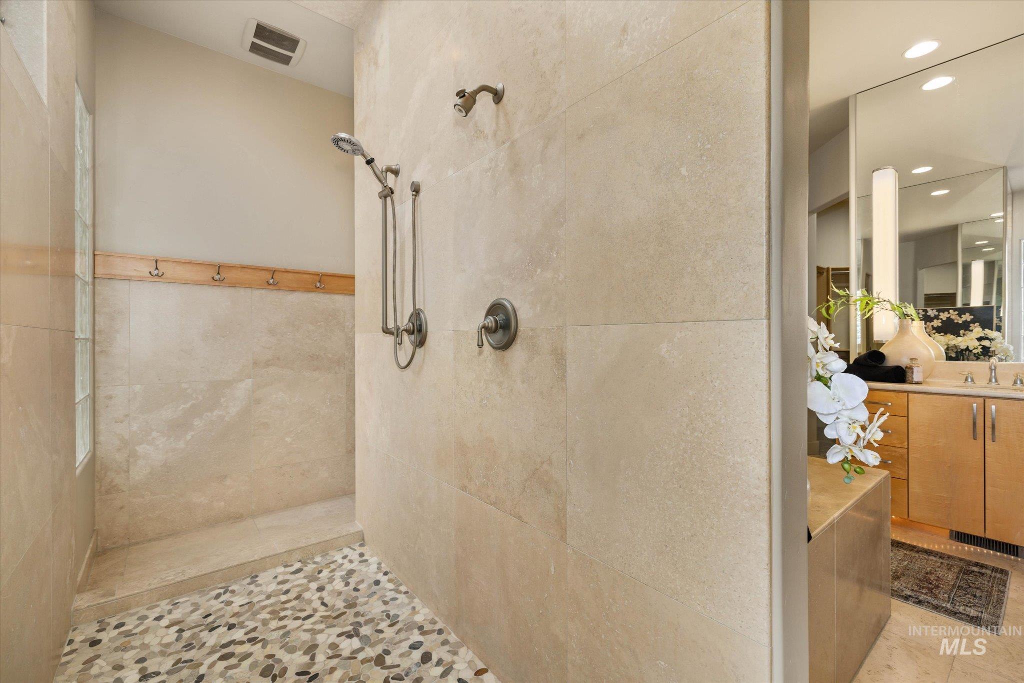 1400 North Razza Way Eagle, ID 83616 - Photo 23 of 50 Bathroom with vanity, a tile shower, and recessed lighting