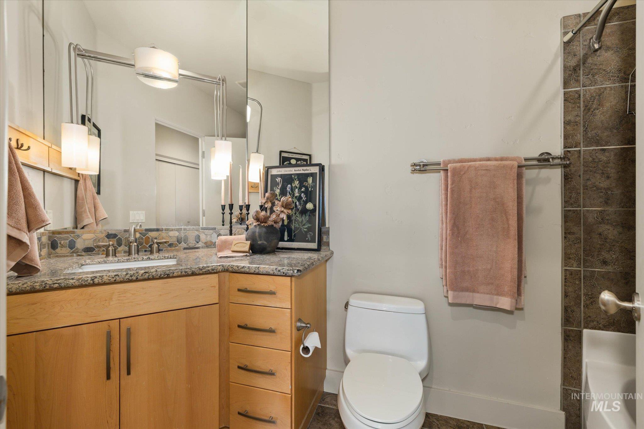 1400 North Razza Way Eagle, ID 83616 - Photo 31 of 50 Full bathroom featuring vanity and bathing tub / shower combination