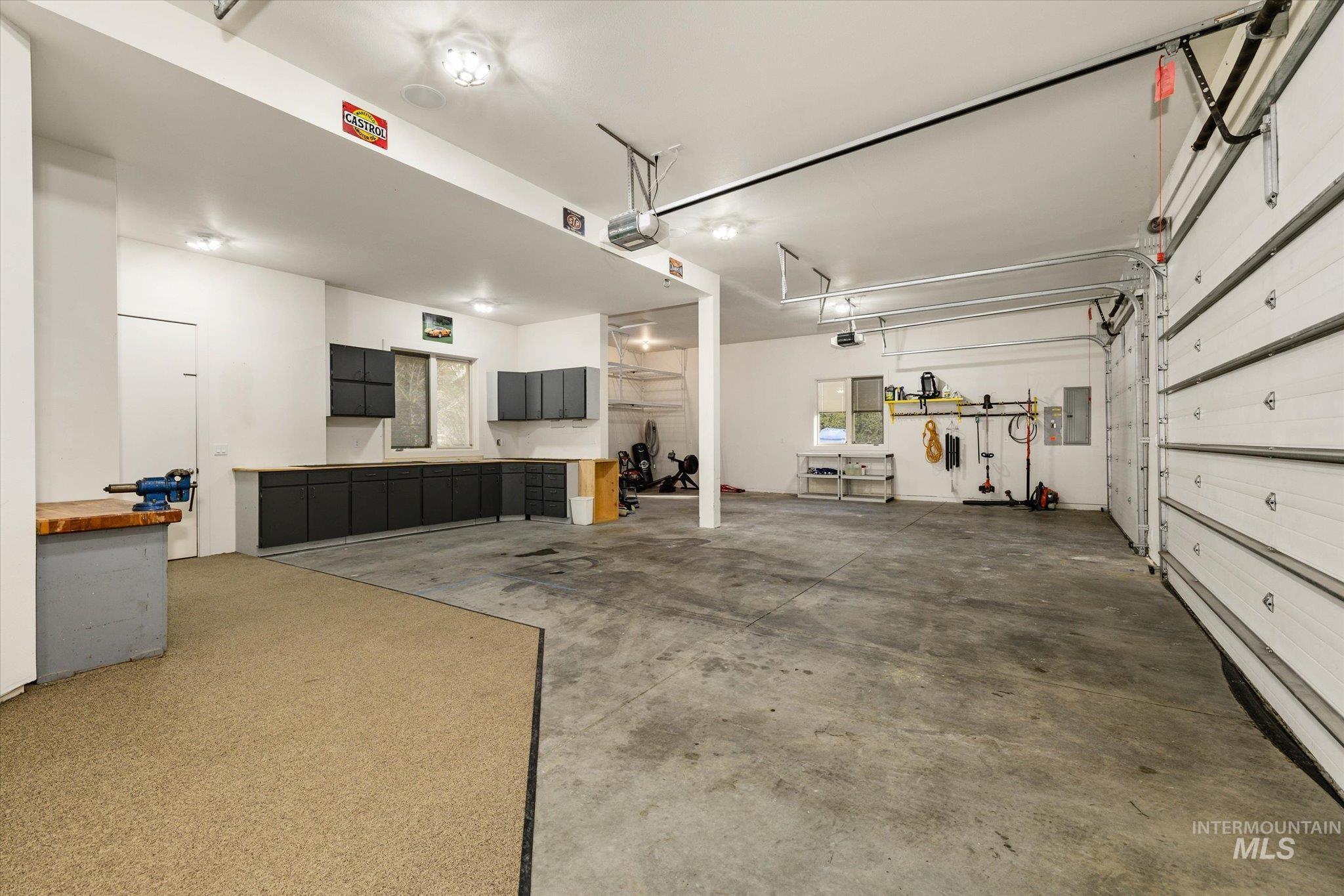 1400 North Razza Way Eagle, ID 83616 - Photo 40 of 50 Garage with electric panel and a garage door opener