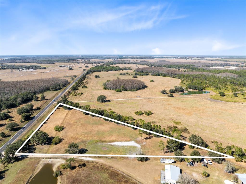 0 North Canoe Creek Road Kenansville, FL 34739 - Photo 7 of 8 an aerial view of residential houses with outdoor space