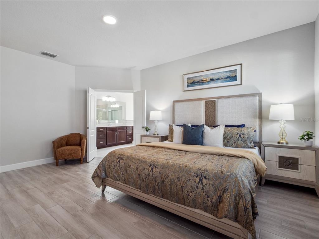 14345 Wabasso Loop Winter Garden, FL 34787 - Photo 12 of 31 a bedroom with a bed and a couch