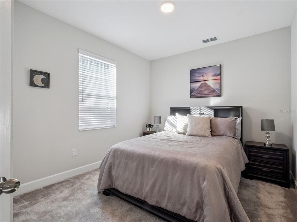 14345 Wabasso Loop Winter Garden, FL 34787 - Photo 17 of 31 a bedroom with bed and a window