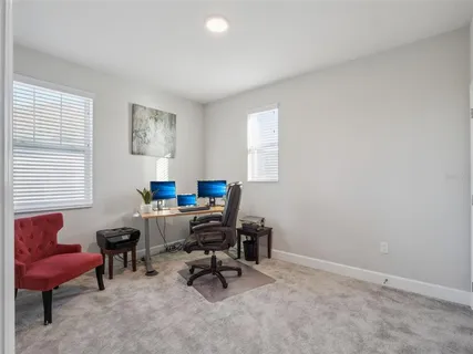 a bathroom with a sink a toilet a mirror a bathtub and shower