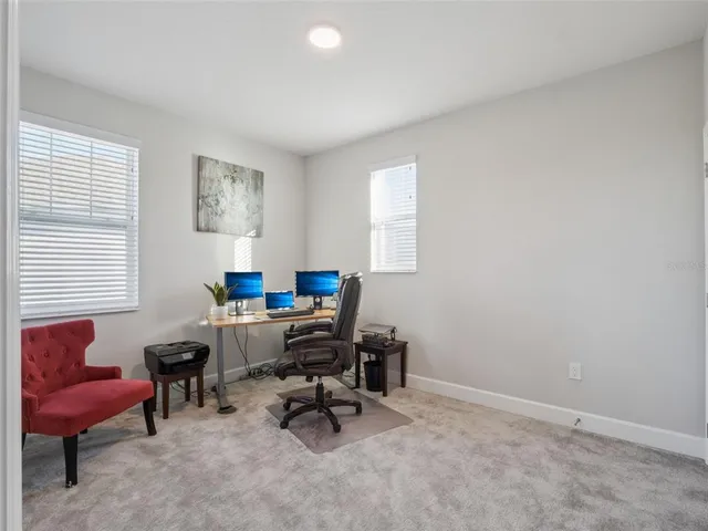 a bathroom with a sink a toilet a mirror a bathtub and shower