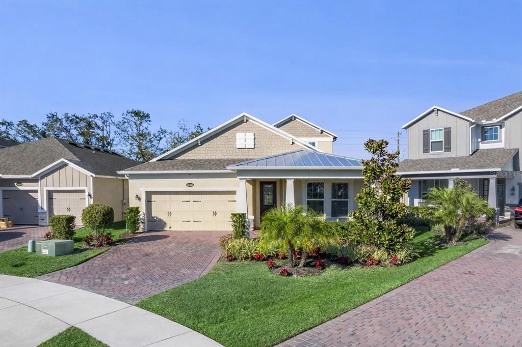14345 Wabasso Loop Winter Garden, FL 34787 - Photo 31 of 31 a front view of a house with a garden and plants