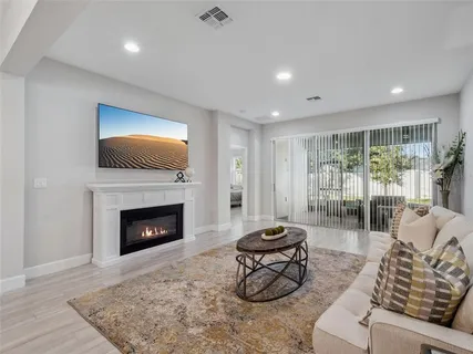 a living room with furniture and a rug