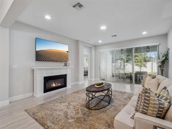 a living room with furniture and a rug