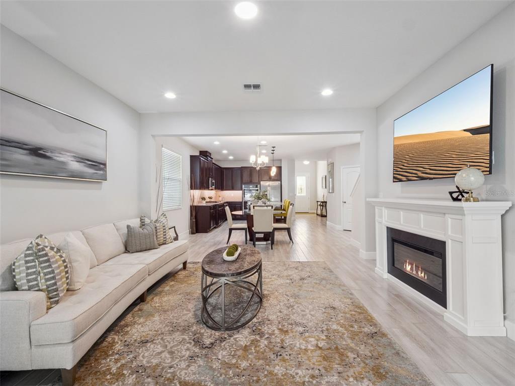 14345 Wabasso Loop Winter Garden, FL 34787 - Photo 9 of 31 a living room with furniture and a fireplace