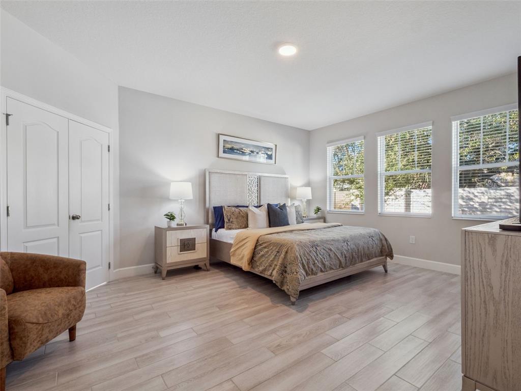 14345 Wabasso Loop Winter Garden, FL 34787 - Photo 10 of 31 a bedroom with a bed and a couch