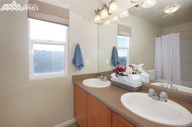 9352 St.George Road Peyton, CO 80831 - Photo 14 of 25 Double sinks in the adjoining master bath